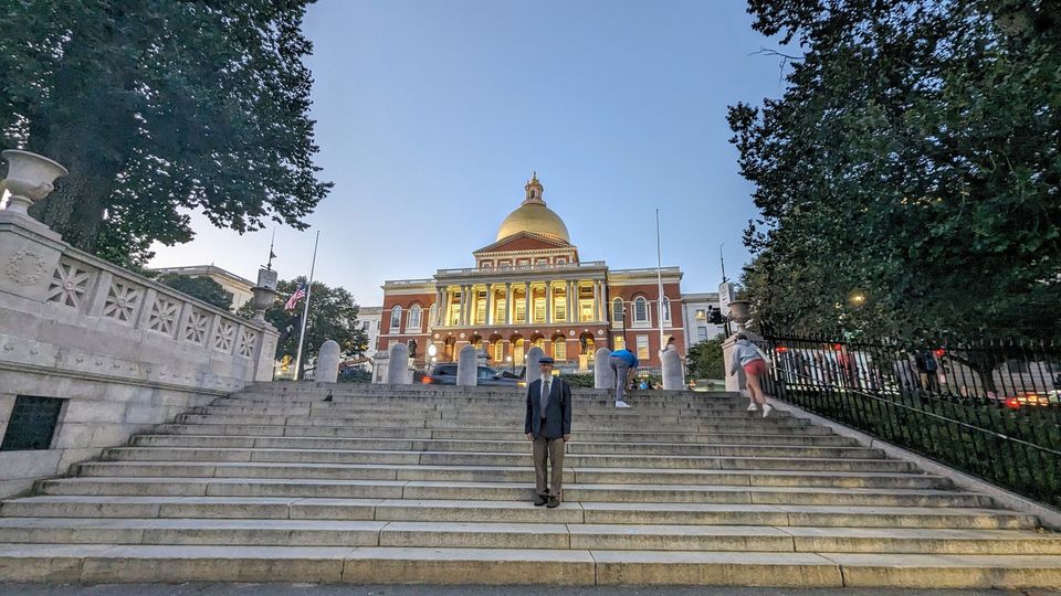 photo of Aaron in front of State House